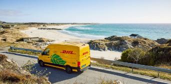 DHL delivery van in front of coast