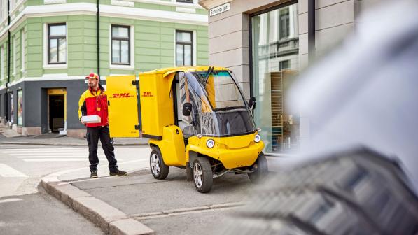 Courier with electric delivery vehicle