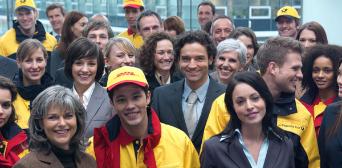 A group of people in office attire and courier clothing.