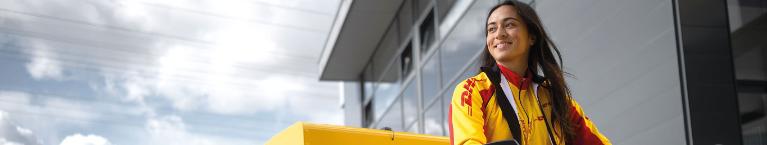 Bicycle courier with long, dark hair and a DHL jacket.